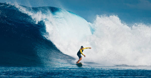 istock Pro surfer rides big wave in the Maldives 2193947343