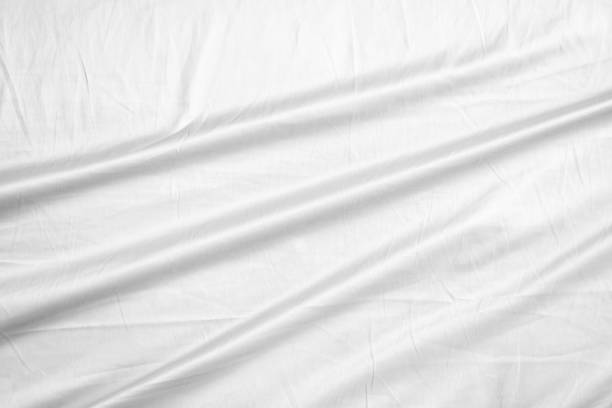 istock Abstract white wrinkled bedding sheet fabric texture background 2193947635