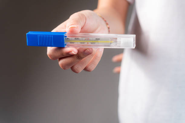 istock Medical Test Kit with Thermometer in Hand 2193947989
