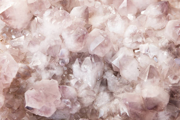 Quartz, druse of pink amethyst-shaped short prismatic crystals. Abstract natural mineral background photo texture