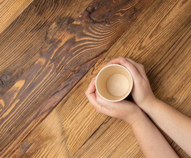 istock Hand Holds Cup, Empty Paper Cup in Hands, Coffee Mug, Teacup, Hot Beverage Mockup, Cup in Arms 2193950430