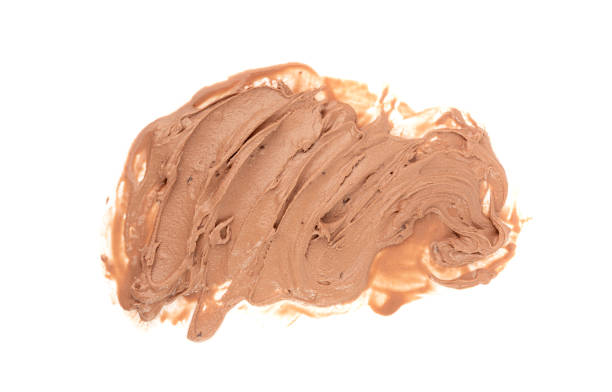Melted chocolate ice cream isolated, real melting cocoa icecream drops, chocolate ice stain puddle on white background