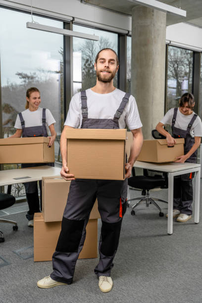istock Bearded caucasain packaging center worker with a cardboard box in hands 2193952610