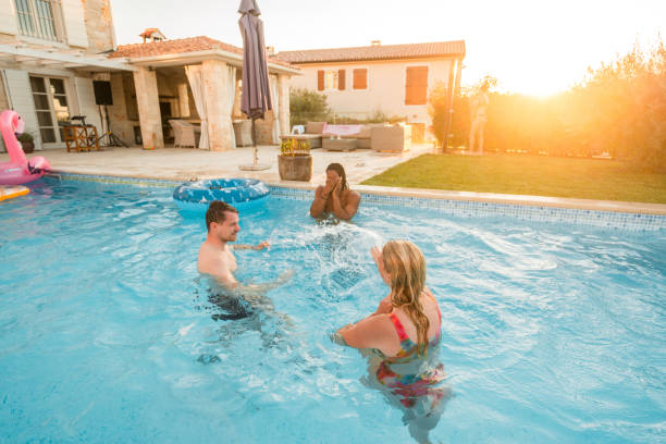 istock Splashy Ball Game at the Diverse Pool Party 2193952743