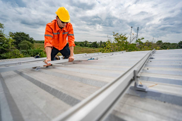 istock Technician in safety uniform and helmet kneeling on a rooftop, using a drill for precise installation work. A scene highlighting safety, professionalism, and technical expertise in construction. 2193952944