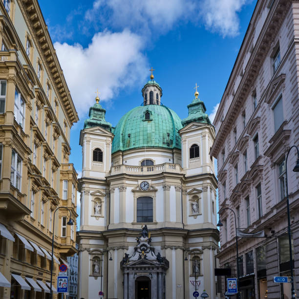 Vienna Austria - Nov 21, 2024:  St. Peter's Catholic Church is cradled amongst other buildings in the Vienna City Center.