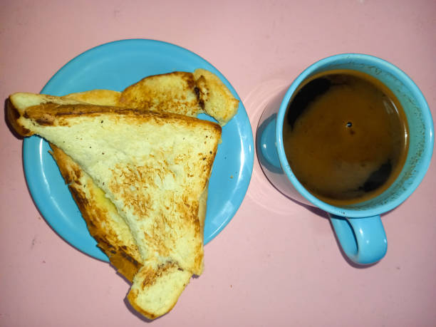 A cup of black coffee and toast is the breakfast menu in the morning