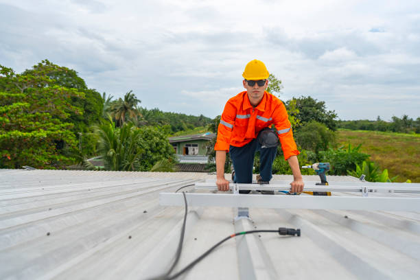 istock Technician in safety uniform and helmet kneeling on a rooftop, using a drill for precise installation work. A scene highlighting safety, professionalism, and technical expertise in construction. 2193954397
