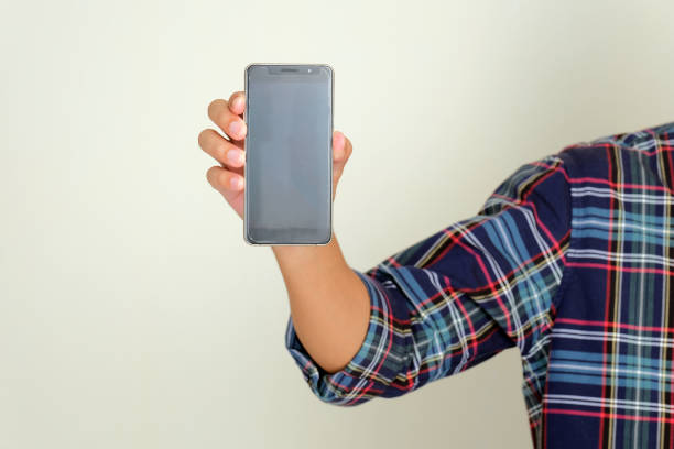 istock Person hand holding and showing blank mobile phone screen display 2193955403