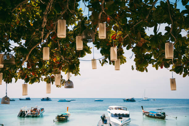 White sand beaches, long tail boats, turquoise ocean - tropical island of Koh Lipe in Satun Province, Thailand