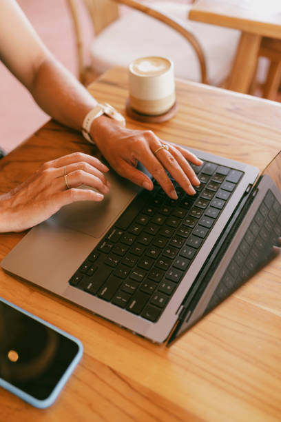 istock Female works remotely from Cafe 2193959528
