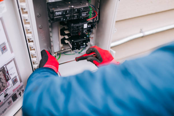electrician working on solar panel specific electrical panel - elektriker bildbanksfoton och bilder