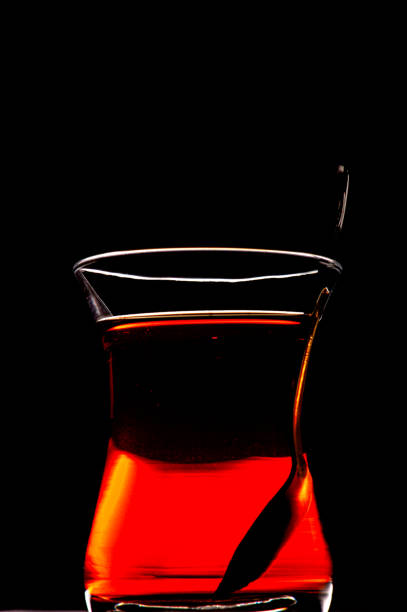 Black tea glass and sugar spoon