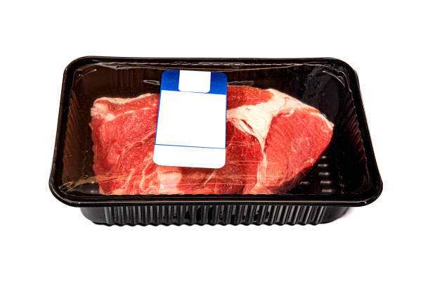 Large slice of steak in a black package with labels