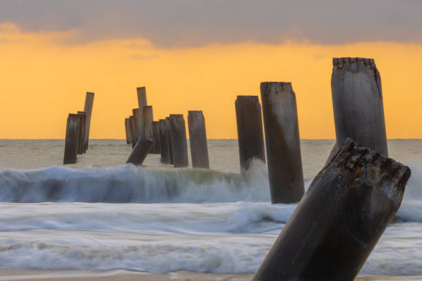 istock A beautiful sunrise at Sao Eang Beach (old leaning cement pillars) Cha-Am beach, Phetchaburi, Thailand 2193967065
