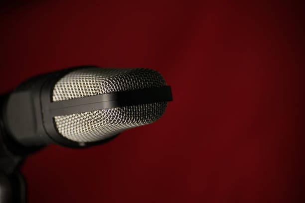 Studio microphones and equipment are used to record sound and the atmosphere inside the room.