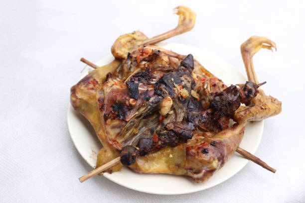 A mouthwatering image of a grilled chicken, perfectly cooked and seasoned.
