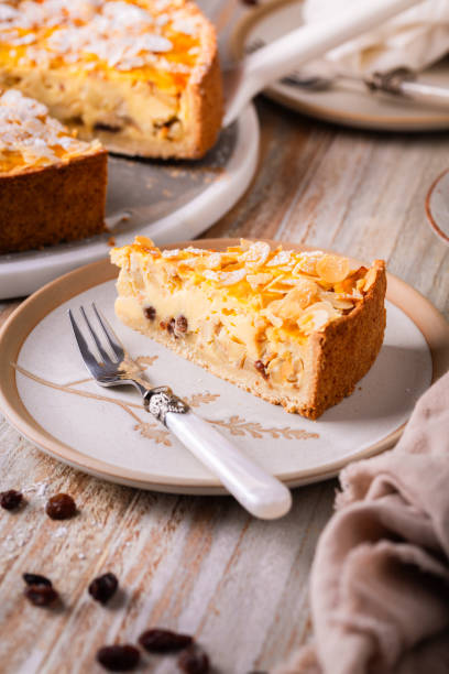 istock Homemade roasting apple cake with almonds and pudding filling with raisins 2193973683