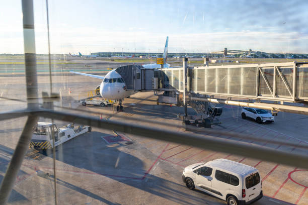istock A bustling modern airport terminal featuring various aircraft parked at the boarding gate 2193973735