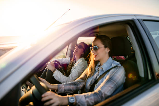 istock Two young women traveling in a car 2193975669