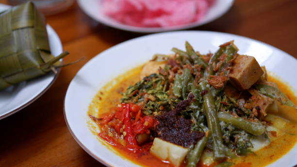 istock Ketupat Sayur Padang or Vegetable Padang rice cake. 2193975706