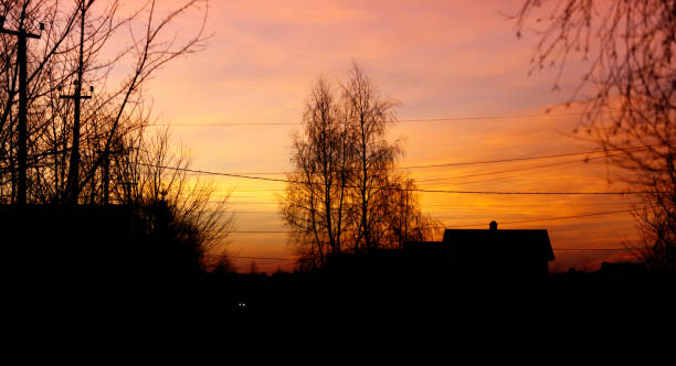 istock A beautiful sunset over a rural area with a house in the background 2193976154