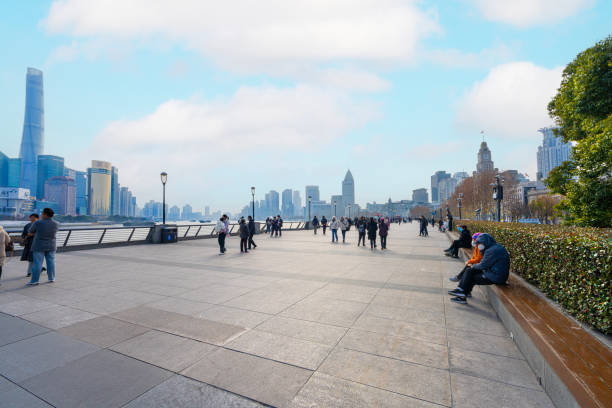 Shanghai, China. January 7, 2025. view of people walking in the afternoon along the Bund in the city center