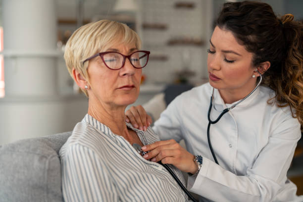istock Attentive Medical Professional Performs Regular Health Check During House Call Visit 2193978020