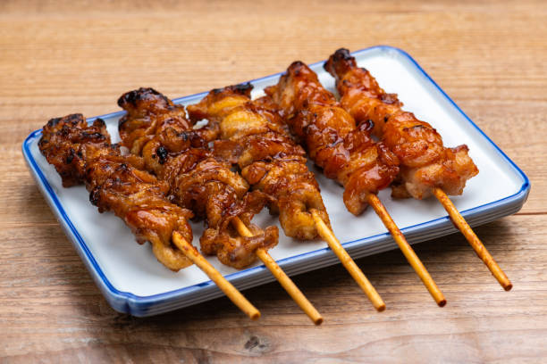 istock Assorted Grilled Chicken Skewers on a Table 2193979029