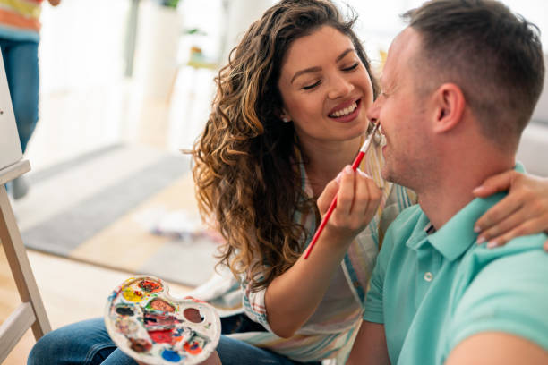 istock Joyful Creative Couple Enjoying Artistic Expression Together in Living Room 2193979284