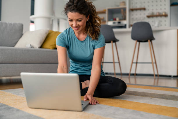 istock Comfortable Woman Working Remotely On Laptop In Contemporary Home Environment 2193983174