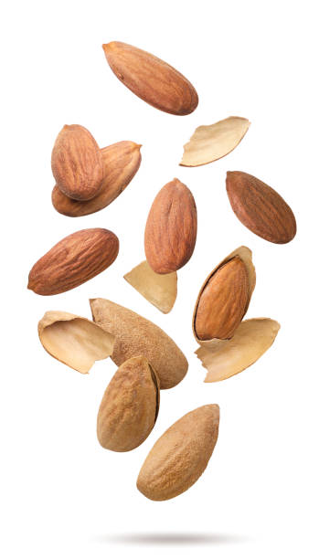 istock Almonds in shell flying close-up on white. Isolated 2193983891
