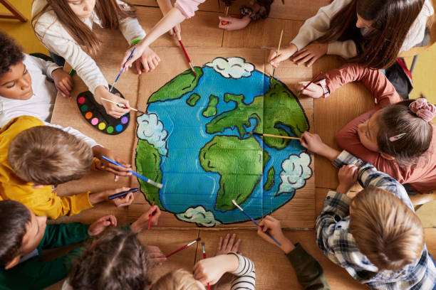 istock Above view of students drawing a planet on art class at elementary school. 2193984688