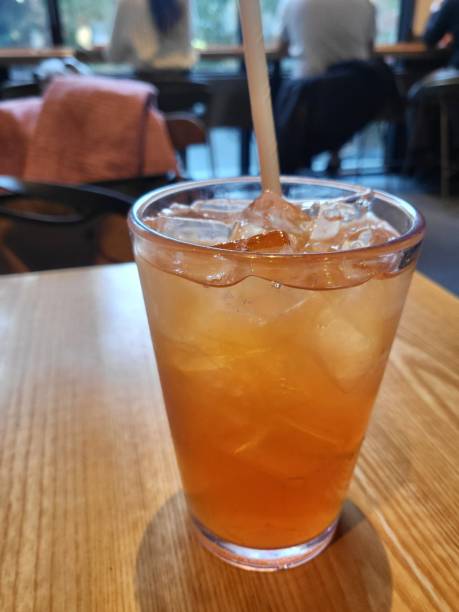 istock Refreshing iced tea served in a chilled glass, featuring a deep amber hue and a light citrus garnish. Perfect for a cooling and revitalizing drink on warm days. 2193985239