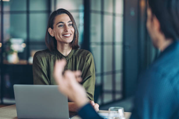 istock Couple of business persons having a conversation 2193988027