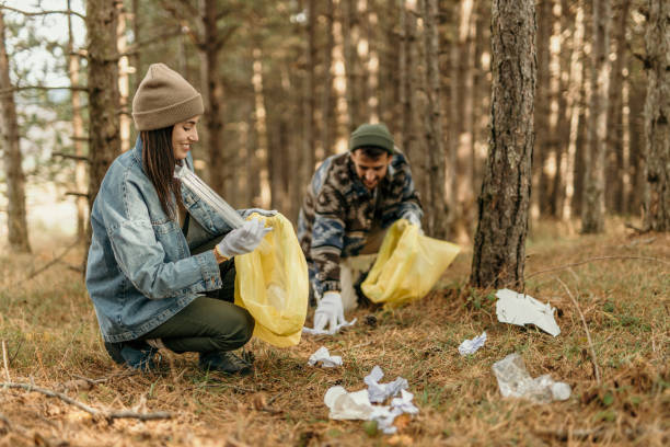 istock Couple clean a park trail 2193989183