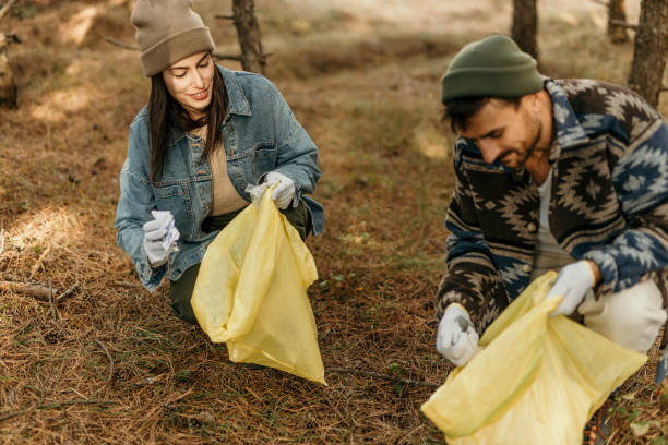 istock Couple clean a park trail 2193989192