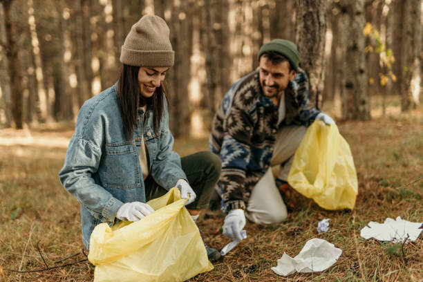 istock Couple clean a park trail 2193989218