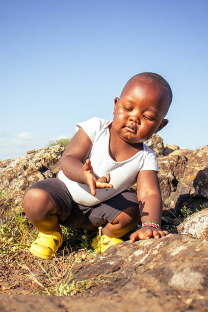 istock A beautiful African baby boy playing outdoors at sunset 2193989497