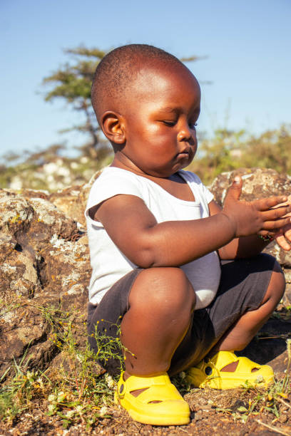 Black boy eat watermelon at home