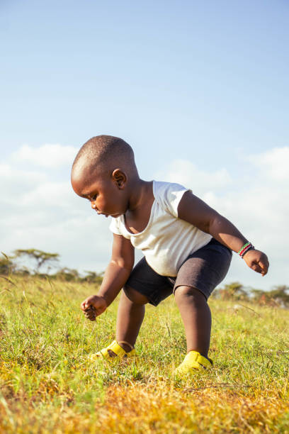 istock A beautfuful African baby boy playing outdoors  at sunset 2193989743