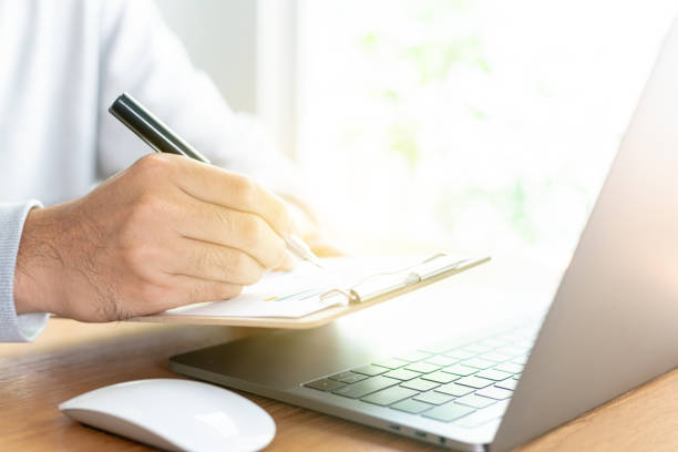 istock Work space at home, financial data graphs, Financial analysis or business evaluation concept 2193990473