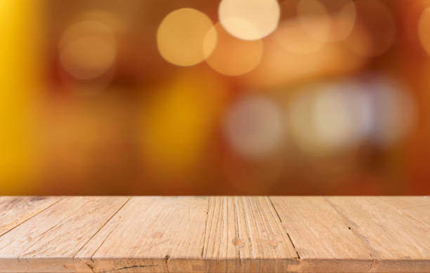 istock Empty wood table top and blur of restaurant background selective focus product display 2193990541