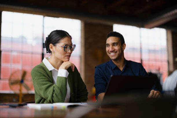 istock Diverse entrepreneurs working on laptop in the office. 2193992265