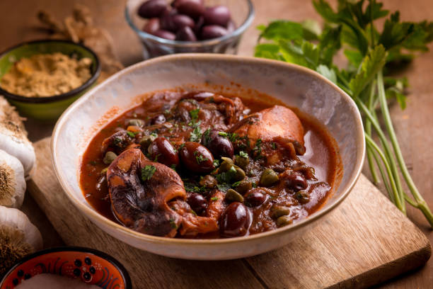 istock stewed polyps with tomato sauce black olives capers and parsley 2193993407