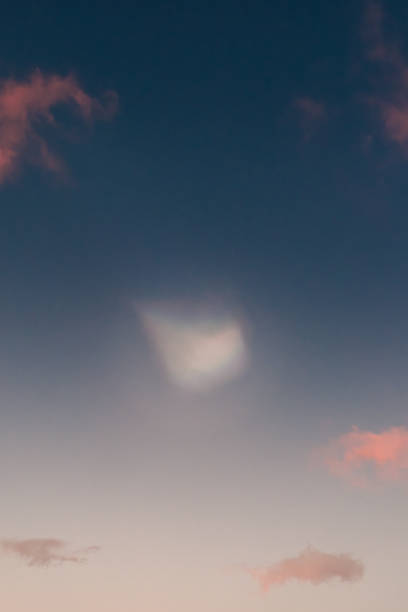 Polar stratospheric clouds glowing at twilight over South Iceland's horizon