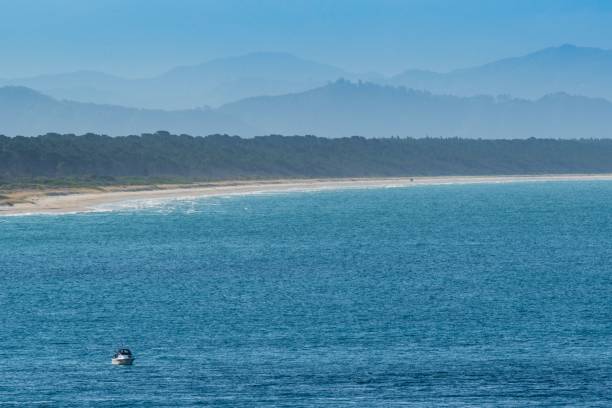 istock Serene coastal scene with boat and blue waters 2193995383
