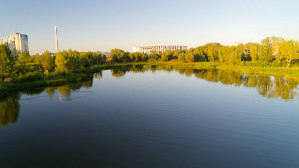 istock Calm lake with a city in the background 2193996683