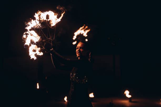 istock fireshow artist woman 2193996829