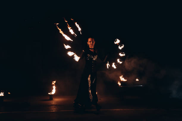 istock fireshow artist woman 2193996838